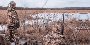 Two Duck Hunters in a Boat